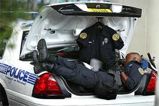 cop sleeping in trunk