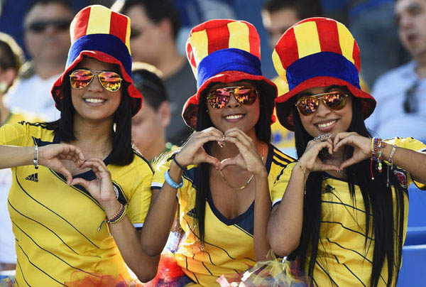 Colombia's fans pose before 2014 World Cup Group C soccer match against Japan at Pantanal arena in Cuiaba