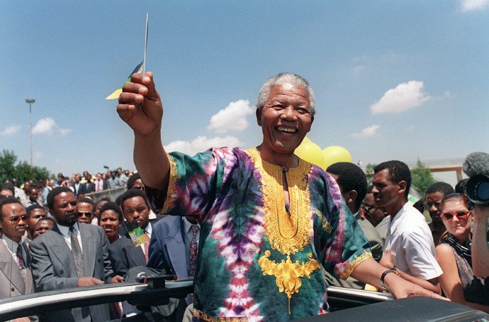 African National Congress (ANC) president Nelson Mandela waves to supporters during an electoral meeting, 29 January 1994 in Johannesburg, as he is campaigning for presidential election. South Africans will vote 27 April 1994 in the country's first democratic and multiracial general elections.